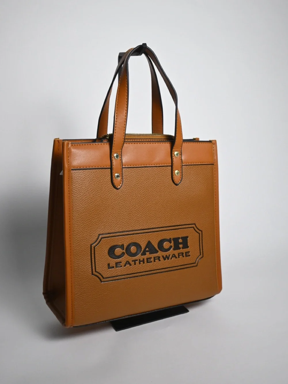 Coach Tan Pebbled Leather Logo Tote with Charm
